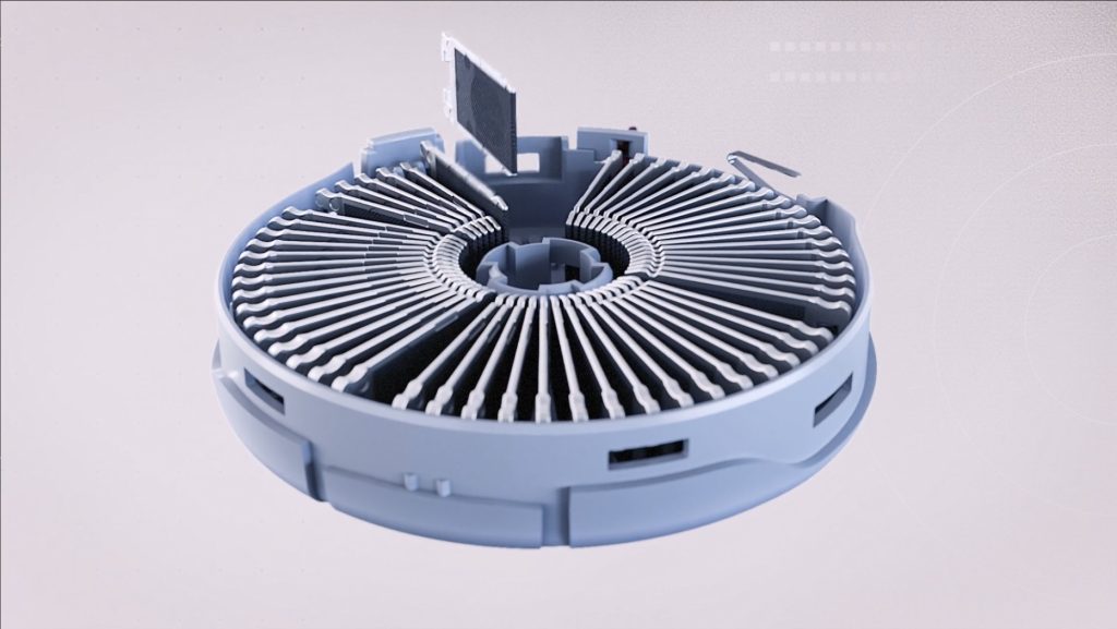 Top view of a circular tech component with ventilation-like design